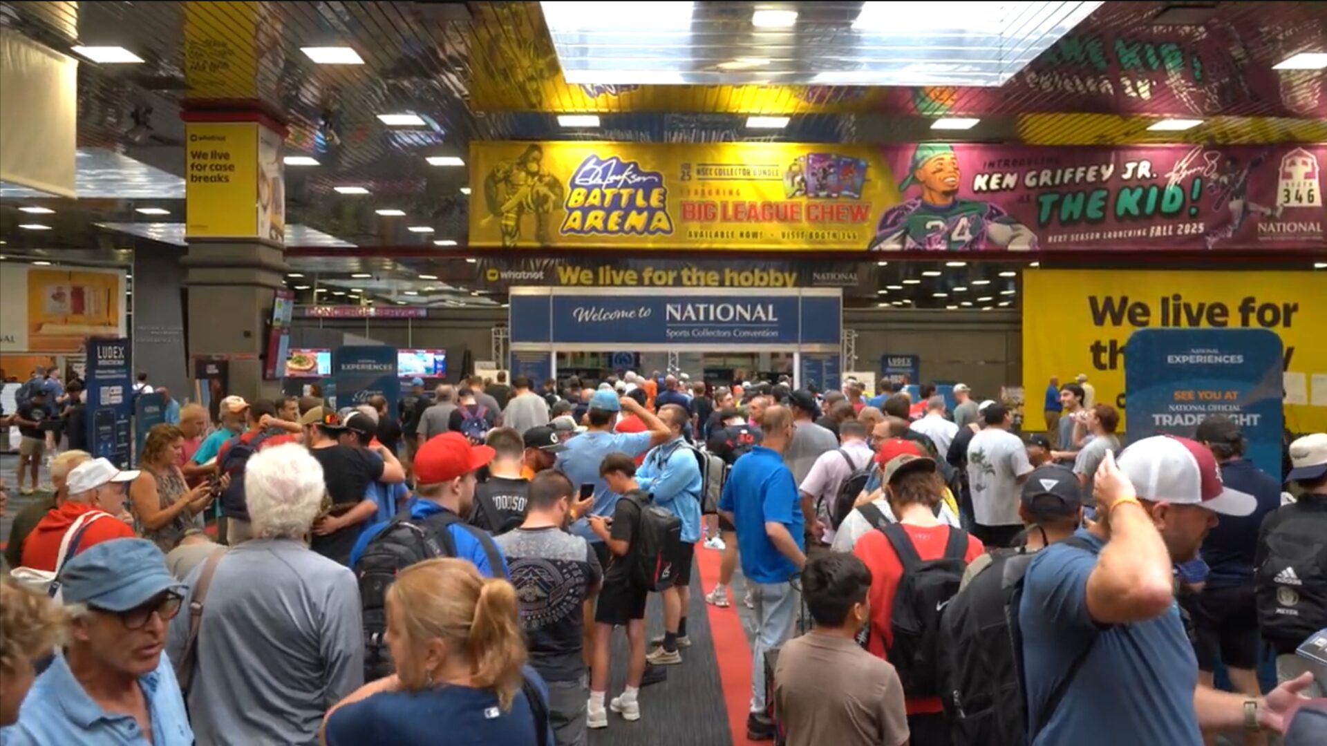 Crowds pour through the Welcome to The National entrance on the convention floor